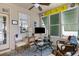 Bright sunroom with white paneled walls, wicker furniture, and lots of natural light at 956 Provincial Cir, Mount Pleasant, SC 29464
