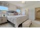 Bedroom with large bed, ceiling fan, two windows, side table, and adjacent walk-in closet at Tbd O'Leary Circle, Summerville, SC 29483