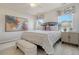 Stylish bedroom with a large bed, neutral tones and natural light from two windows at Tbd O'Leary Circle, Summerville, SC 29483