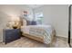 Cozy bedroom features natural light, a wooden bed frame, and stylish nautical-themed wall decor at Tbd O'Leary Circle, Summerville, SC 29483