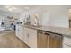 Open kitchen concept with granite countertops, stainless appliances, and seamless flow into the living area at Tbd O'Leary Circle, Summerville, SC 29483