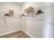 Walk-in closet featuring white wire shelving, laminate floors, and hanging storage at Tbd O'Leary Circle, Summerville, SC 29483