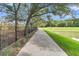 Scenic walking path alongside a lake, shaded by mature trees at Tbd O'Leary Circle, Summerville, SC 29483