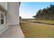 Spacious backyard with a view of a serene pond surrounded by lush greenery at 1014 Marsh Harrier Dr # Cc3-1-5, Ravenel, SC 29470