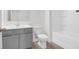 Bathroom featuring gray cabinets, a tiled shower and modern fixtures at 1014 Marsh Harrier Dr # Cc3-1-5, Ravenel, SC 29470