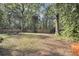Picturesque backyard featuring a seating area, lush greenery, and mature trees at 109 Dan Miler Ln, Summerville, SC 29483