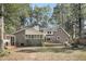 Spacious backyard featuring a patio, firepit, and lush greenery, creating a private outdoor retreat at 109 Dan Miler Ln, Summerville, SC 29483