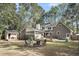 Large backyard with a patio, firepit, and shed, perfect for outdoor activities and storage at 109 Dan Miler Ln, Summerville, SC 29483