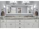 Bright bathroom featuring double vanity with granite counters, white cabinets, and modern fixtures at 109 Dan Miler Ln, Summerville, SC 29483