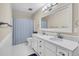 Bright bathroom with a double sink vanity, white cabinets, and modern lighting fixtures at 109 Dan Miler Ln, Summerville, SC 29483