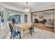 Bright dining room with large windows and an open entryway to the living room at 109 Dan Miler Ln, Summerville, SC 29483