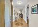 Spacious foyer featuring hardwood floors with inlay design and views of the staircase and dining area at 109 Dan Miler Ln, Summerville, SC 29483