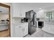 Kitchen featuring modern appliances, white cabinets, marble countertops, and tiled flooring at 109 Dan Miler Ln, Summerville, SC 29483
