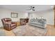 Comfortable living room featuring hardwood floors, a patterned rug, and a cozy seating area at 109 Dan Miler Ln, Summerville, SC 29483