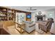 Inviting living room with hardwood floors, built-in bookshelves, a cozy fireplace, and comfortable seating at 109 Dan Miler Ln, Summerville, SC 29483