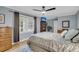 Spacious primary bedroom with hardwood floors, ceiling fan, and a large window at 109 Dan Miler Ln, Summerville, SC 29483