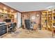 Well-lit home office featuring built-in shelves, a desk, and hardwood floors, ideal for work or study at 109 Dan Miler Ln, Summerville, SC 29483