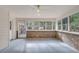 Cozy sunroom with brick accent wall and lots of natural light at 109 Dan Miler Ln, Summerville, SC 29483