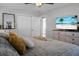 Bedroom featuring light wood floors, a ceiling fan, wall art, blinds, a flat-screen TV, and a white-painted dresser at 1113 Smithfield Pl, Hanahan, SC 29410