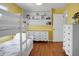 Bedroom showcasing bright yellow walls, a comfortable bunk bed, and a dresser with shelves for storage at 1113 Smithfield Pl, Hanahan, SC 29410