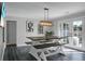 Open dining space showcasing modern table set with bench seating and French doors at 1113 Smithfield Pl, Hanahan, SC 29410