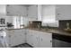 Bright kitchen featuring white cabinetry, wood countertops, and stainless-steel sink at 1113 Smithfield Pl, Hanahan, SC 29410