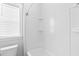 Bright bathroom featuring a tub and shower combo, complemented by a window for natural light at 1213 Captain Rivers Dr, Charleston, SC 29412