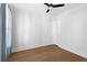 This bright bedroom features hardwood floors, a ceiling fan, and large windows with plenty of natural light at 1213 Captain Rivers Dr, Charleston, SC 29412