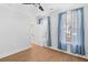 Bright bedroom featuring hardwood floors, sheer curtains, and ample natural light from the window at 1213 Captain Rivers Dr, Charleston, SC 29412