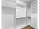 Bright, spacious closet with white shelving, drawers, and clothing racks for optimal storage and organization at 1213 Captain Rivers Dr, Charleston, SC 29412