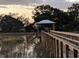 A beautiful private dock with covered pierhead overlooking marshland and ready for your boat at 1213 Captain Rivers Dr, Charleston, SC 29412