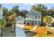 Beautiful two-story home featuring a front porch, a separate garage, and a well-maintained lawn at 1213 Captain Rivers Dr, Charleston, SC 29412