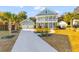 Attractive two-story home with manicured landscaping, a detached garage, and a spacious driveway at 1213 Captain Rivers Dr, Charleston, SC 29412
