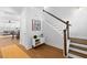 Bright foyer featuring hardwood floors, staircase, and stylish decor at 1213 Captain Rivers Dr, Charleston, SC 29412