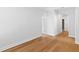 A neutral hallway features hardwood floors with access to multiple rooms from a central location at 1213 Captain Rivers Dr, Charleston, SC 29412