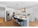 Modern kitchen with stainless steel appliances, a central island, and stylish lighting at 1213 Captain Rivers Dr, Charleston, SC 29412