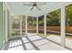 Inviting screened-in porch with ceiling fan, offering a serene outdoor living space at 1213 Captain Rivers Dr, Charleston, SC 29412