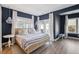 Serene bedroom with blue walls, hardwood floors, and natural light at 1213 Gatch Ct, Mount Pleasant, SC 29464