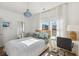 Inviting bedroom featuring a comfortable bed, soft natural light, and complemented by a desk and decor at 1213 Gatch Ct, Mount Pleasant, SC 29464