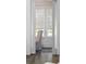View through doorway to a bright dining room with grey chair and natural light at 1213 Gatch Ct, Mount Pleasant, SC 29464