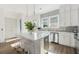 Bright kitchen featuring quartz counters, stainless appliances, and island with seating at 1213 Gatch Ct, Mount Pleasant, SC 29464