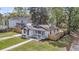 Aerial view of a charming home with a well-manicured lawn, fenced yard, and inviting curb appeal at 1249 Sumner Ave, North Charleston, SC 29406