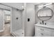 Beautiful bathroom with marble tiled shower and modern vanity at 1249 Sumner Ave, North Charleston, SC 29406