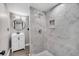 Bathroom shows tiled shower and modern vanity with round mirror at 1249 Sumner Ave, North Charleston, SC 29406