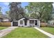 Beautifully renovated bungalow with a lush lawn, offering curb appeal and a welcoming entrance at 1249 Sumner Ave, North Charleston, SC 29406