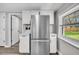 Renovated kitchen boasts stainless steel refrigerator and updated cabinets at 1249 Sumner Ave, North Charleston, SC 29406