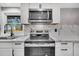 Modern kitchen with stainless steel appliances, quartz countertops, and a window over the sink at 1249 Sumner Ave, North Charleston, SC 29406
