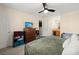 Cozy bedroom with ceiling fan, dresser, television, and attached bath at 1306 Markley Ct, Moncks Corner, SC 29461
