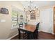 Cozy dining area featuring a wood table, chandelier lighting, and decorative wall decor, creating a warm and inviting space at 1306 Markley Ct, Moncks Corner, SC 29461