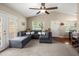 Spacious living room with vaulted ceilings, large sectional sofa, and natural light from the entryway and adjacent room at 1306 Markley Ct, Moncks Corner, SC 29461